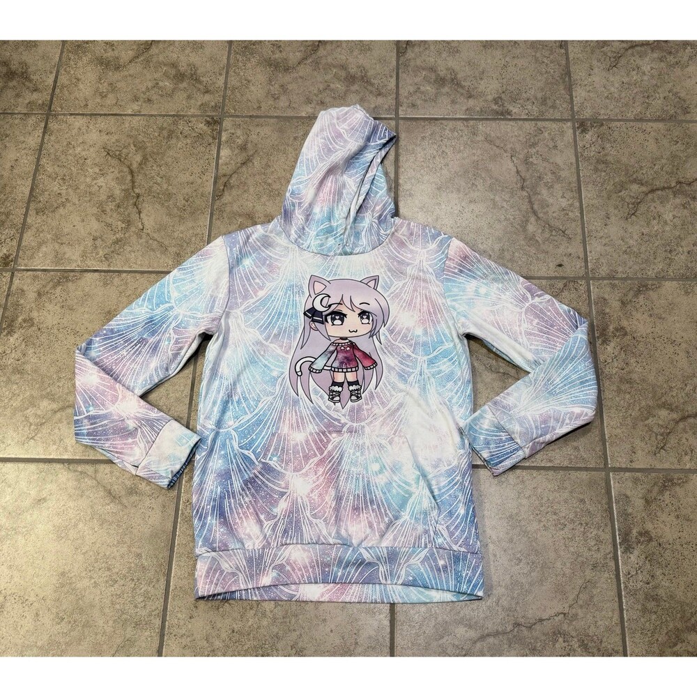 Gacha Life pullover hoodie features a pastel galaxy-shell pattern chibi